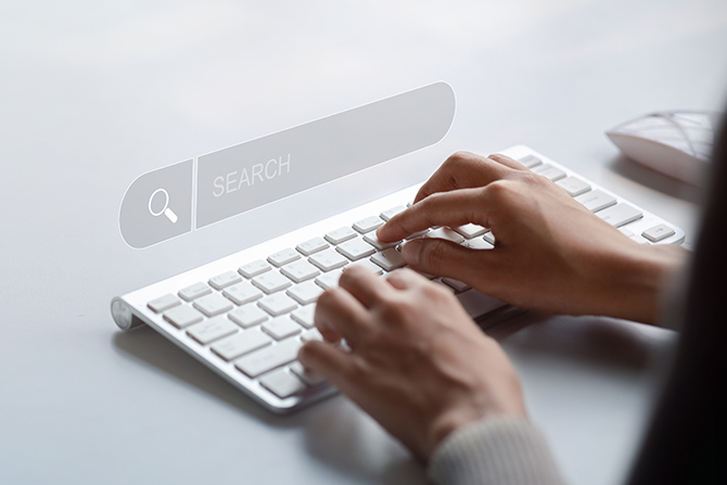 Person at keyboard doing a search